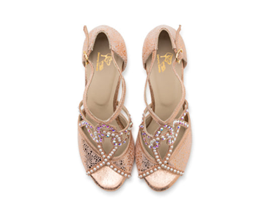 Draufsicht der Vela-Tanzschuhe von Dancing Queens in Gold mit rosa überkreuzten Riemen mit violetten Edelsteinen und Perlen.